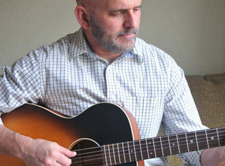 stephen-ruppe-playing-martin-acoustic-guitar