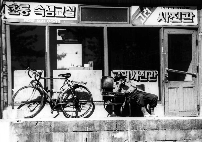 Local taking a nap on the streets of Waegwan South Korea