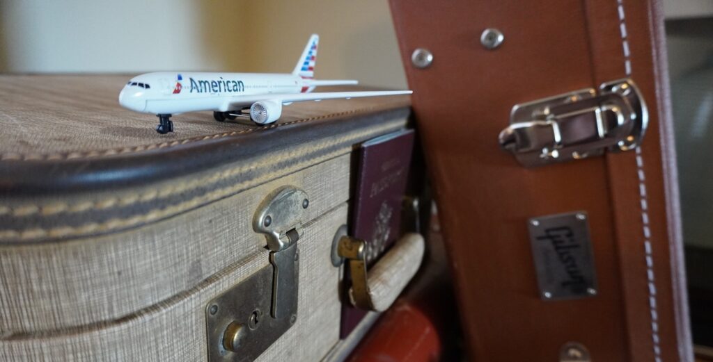 American Airlines Toy Plane and Gibson J45TV Acoustic Guitar and Passport
