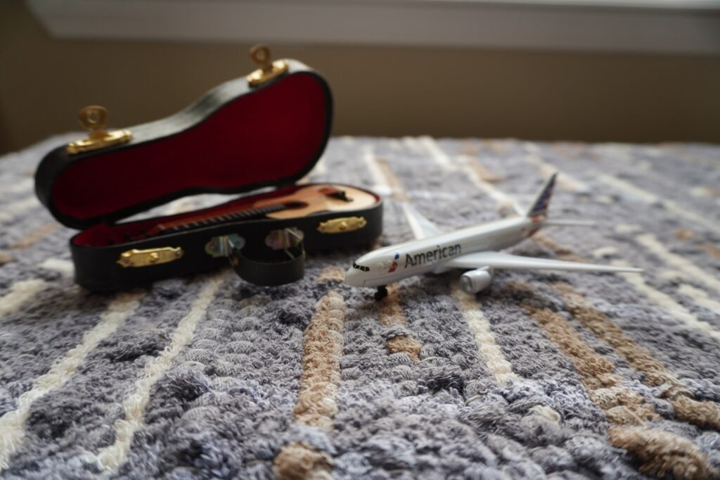 American Airlines Toy Plane and Toy Acoustic Guitar